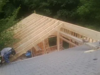 Framing a new roof addition that ties into an existing shingle roof in Minneota